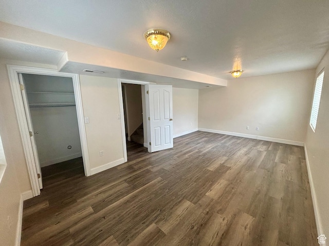 192 S 100 E, Wellsville, UT 84339 - unfurnished bedroom with dark wood finished floors, a spacious closet, and a closet