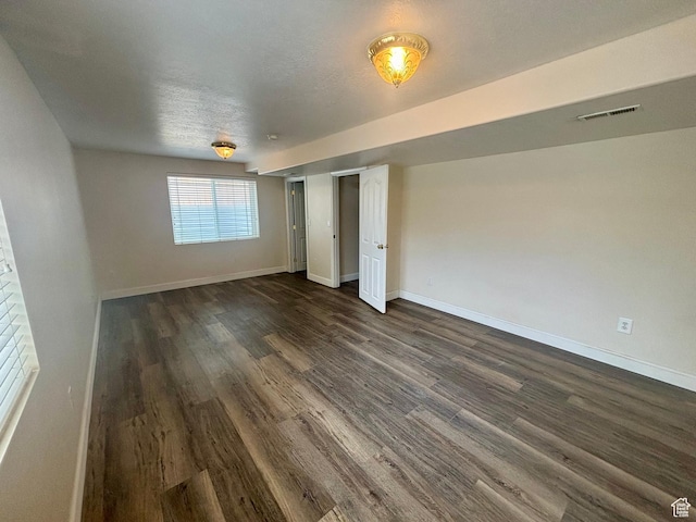192 S 100 E, Wellsville, UT 84339 - unfurnished bedroom with dark wood-style floors and baseboards