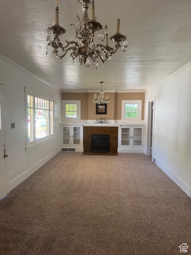 248 E 300 S, Springville, UT 84663 - unfurnished living room with a chandelier, crown molding, healthy amount of natural light, baseboards, and a fireplace with flush hearth
