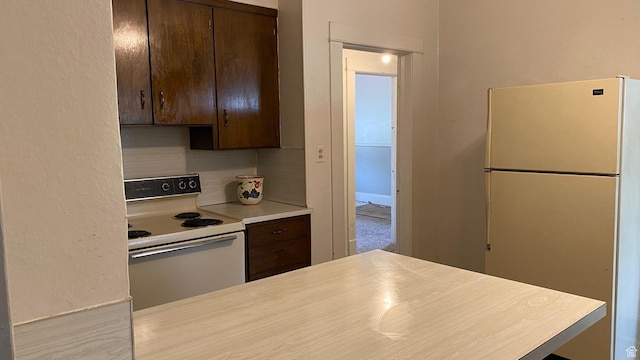 248 E 300 S, Springville, UT 84663 - kitchen with white appliances, dark brown cabinets, and light countertops