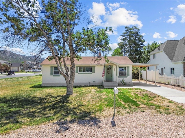496 N 500 E, Nephi, UT 84648 - view of front of home featuring concrete driveway, stucco siding, and a carport
