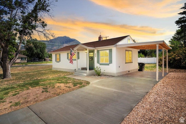 496 N 500 E, Nephi, UT 84648 - view of front of house featuring concrete driveway, a carport, a chimney, and crawl space
