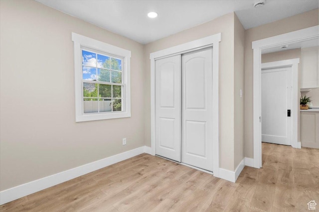 496 N 500 E, Nephi, UT 84648 - unfurnished bedroom with baseboards, light wood-type flooring, a closet, and recessed lighting