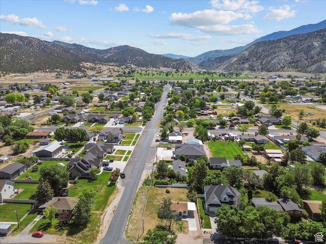 496 N 500 E, Nephi, UT 84648 - aerial view of property and surrounding area featuring a mountainous background and nearby suburban area
