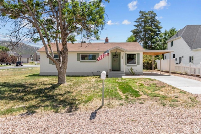 496 N 500 E, Nephi, UT 84648 - view of front of house featuring concrete driveway, a carport, and stucco siding