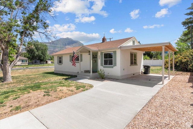 496 N 500 E, Nephi, UT 84648 - ranch-style home featuring concrete driveway, a mountain view, a carport, and a front yard