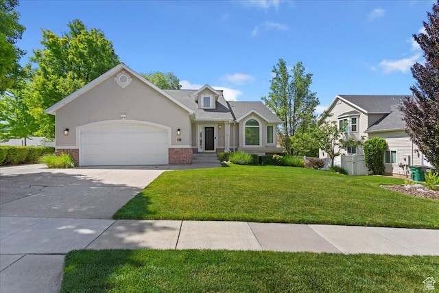 118 E 600 S, Kaysville, UT 84037 - traditional-style home with concrete driveway, an attached garage, a front lawn, brick siding, and stucco siding