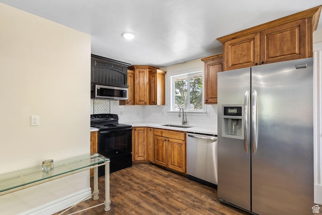 830 W 630 N, Orem, UT 84057 - kitchen featuring stainless steel appliances, a sink, dark wood-style floors, light countertops, and tasteful backsplash