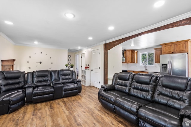 830 W 630 N, Orem, UT 84057 - living area with ornamental molding, light wood-style floors, recessed lighting, and arched walkways
