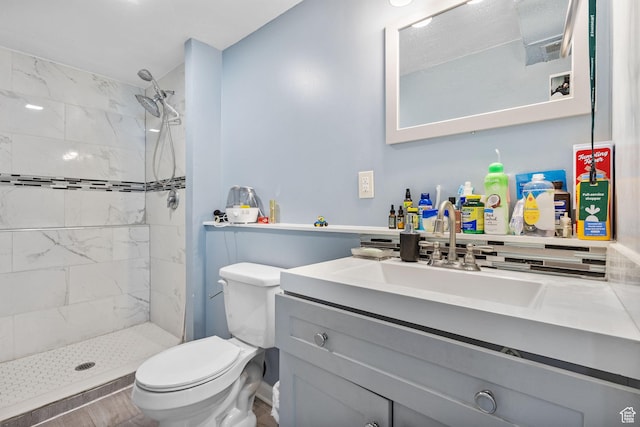 830 W 630 N, Orem, UT 84057 - bathroom with toilet, tiled shower, vanity, and wood finished floors