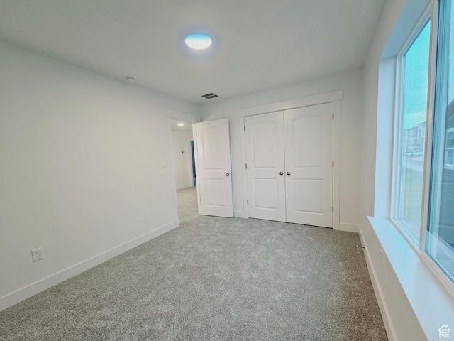 13494 S Dawes Ln W Unit 1703, Riverton, UT 84096 - unfurnished bedroom featuring carpet, multiple windows, and baseboards