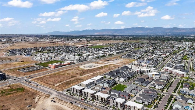 10849 S Lake Run Rd Unit 187, South Jordan, UT 84009 - aerial overview of property's location with a mountain backdrop and nearby suburban area