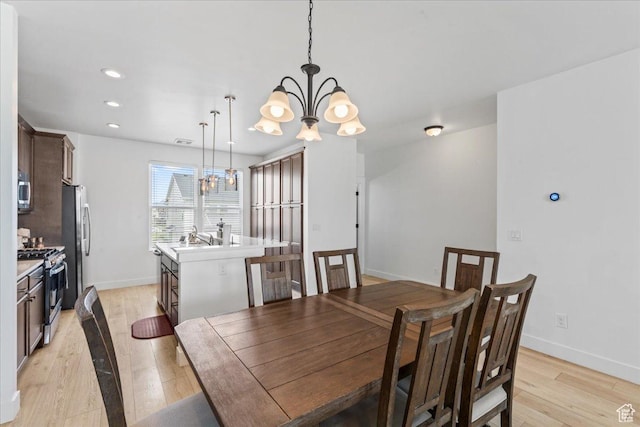10849 S Lake Run Rd Unit 187, South Jordan, UT 84009 - dining area with a chandelier, light wood-type flooring, baseboards, and recessed lighting