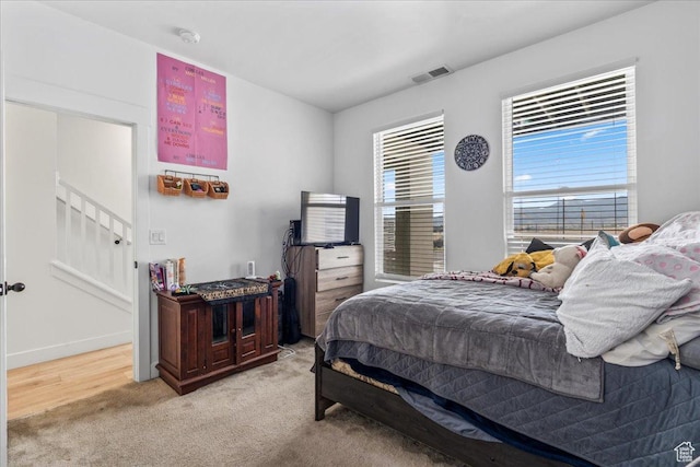 10849 S Lake Run Rd Unit 187, South Jordan, UT 84009 - bedroom featuring light carpet and baseboards