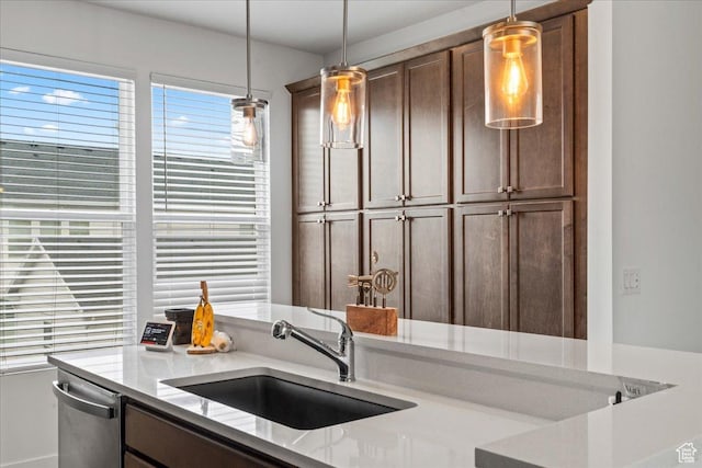 10849 S Lake Run Rd Unit 187, South Jordan, UT 84009 - kitchen with a sink, pendant lighting, dishwasher, and light stone countertops