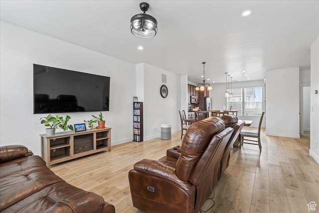 10849 S Lake Run Rd Unit 187, South Jordan, UT 84009 - living area with light wood finished floors, a chandelier, baseboards, and recessed lighting