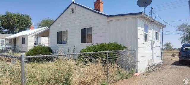 138 W Geneva Dr, East Carbon, UT 84520 - view of side of home with a chimney