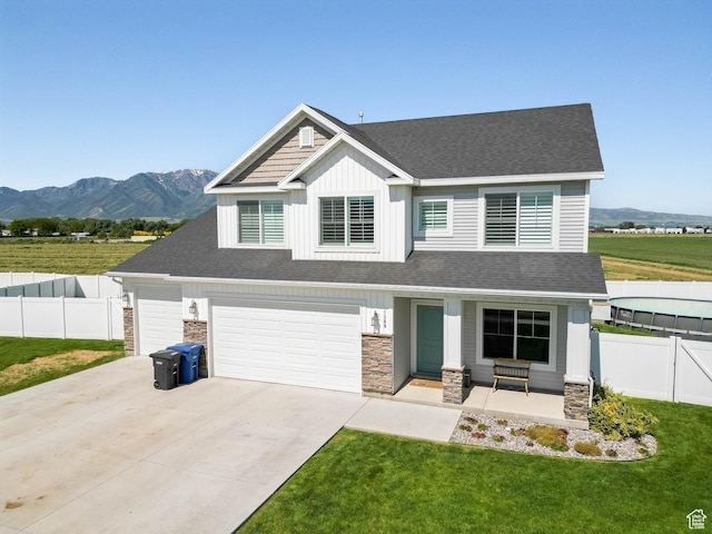 1389 W 2870 S, Nibley, UT 84321 - craftsman-style home featuring stone siding, a porch, and board and batten siding