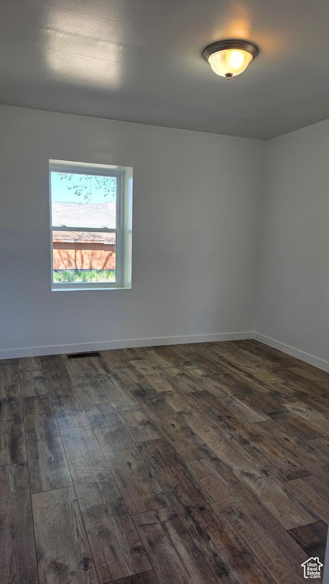 20915 W 1300 S, Malad City, ID 83252 - spare room featuring dark wood-style flooring and baseboards