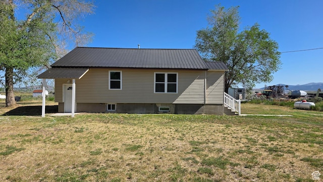 20915 W 1300 S, Malad City, ID 83252 - rear view of property featuring a yard and metal roof