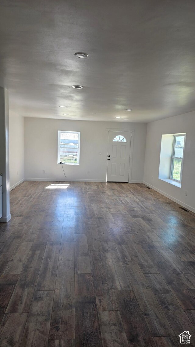 20915 W 1300 S, Malad City, ID 83252 - foyer entrance with dark wood-style flooring, plenty of natural light, and baseboards