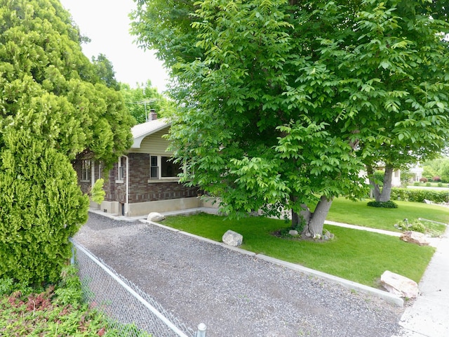 67 S 200 E, Pleasant Grove, UT 84062 - obstructed view of property with a front lawn and a chimney