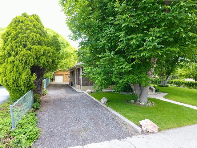 67 S 200 E, Pleasant Grove, UT 84062 - view of property hidden behind natural elements featuring gravel driveway and a garage