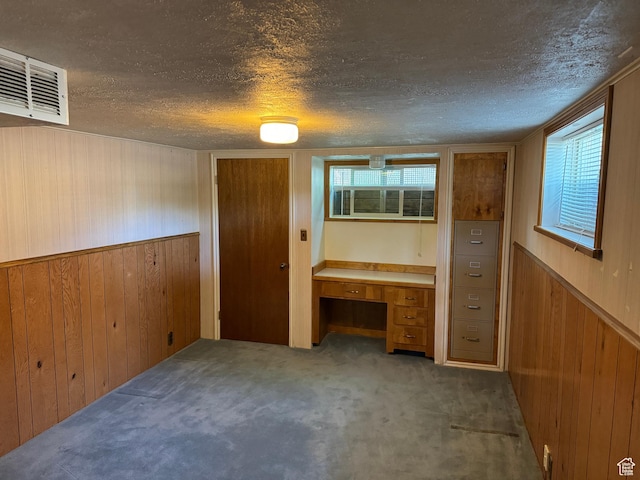 67 S 200 E, Pleasant Grove, UT 84062 - unfurnished bedroom featuring wooden walls, a textured ceiling, carpet, wainscoting, and a desk