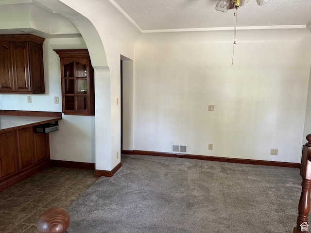 67 S 200 E, Pleasant Grove, UT 84062 - unfurnished dining area featuring dark colored carpet, baseboards, and arched walkways