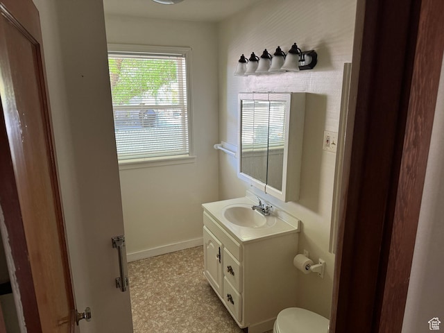 67 S 200 E, Pleasant Grove, UT 84062 - bathroom featuring vanity, toilet, and baseboards