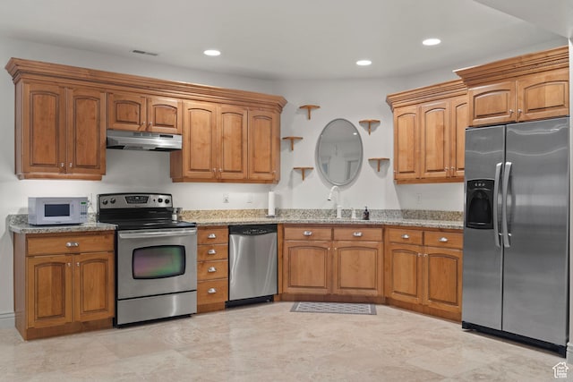 503 W 650 S, Orem, UT 84058 - kitchen featuring stainless steel appliances, under cabinet range hood, light stone counters, brown cabinetry, and recessed lighting