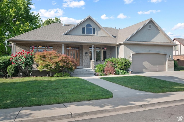 503 W 650 S, Orem, UT 84058 - view of front facade featuring a porch, an attached garage, a front lawn, concrete driveway, and stucco siding