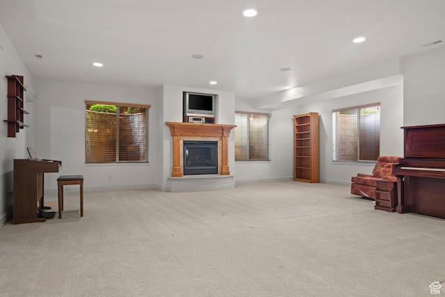 503 W 650 S, Orem, UT 84058 - carpeted living room featuring a glass covered fireplace, recessed lighting, baseboards, and healthy amount of natural light