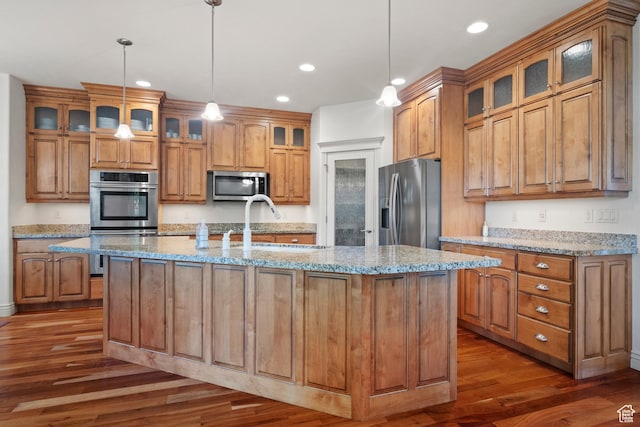 503 W 650 S, Orem, UT 84058 - kitchen featuring appliances with stainless steel finishes, dark wood-style flooring, recessed lighting, brown cabinets, and a sink