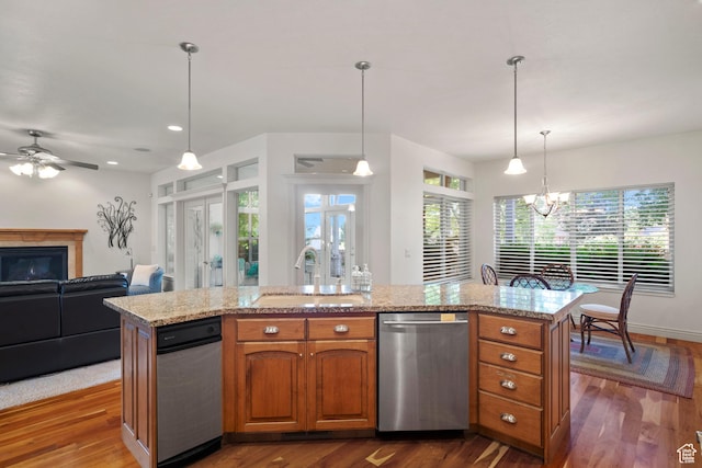503 W 650 S, Orem, UT 84058 - kitchen featuring dishwasher, a sink, brown cabinets, dark wood-style floors, and a ceiling fan