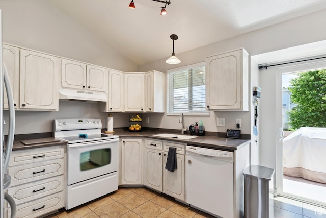 4293 W 5550 S, Roy, UT 84067 - kitchen featuring white appliances, under cabinet range hood, dark countertops, a sink, and light tile patterned floors