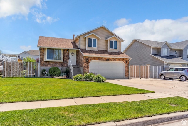 4293 W 5550 S, Roy, UT 84067 - tri-level home with driveway, stone siding, a garage, and a gate