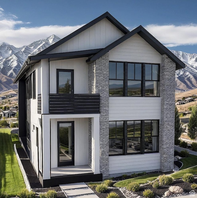 10727 N Dosh Ln, Highland, UT 84003 - view of front facade with a mountain view and board and batten siding