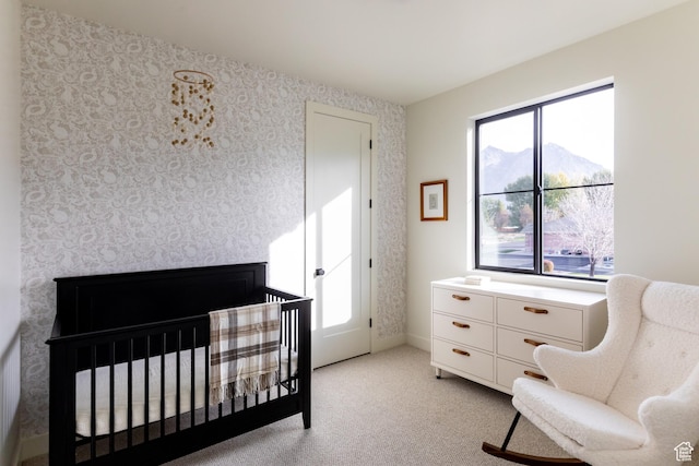 10727 N Dosh Ln, Highland, UT 84003 - bedroom featuring light carpet, a crib, and wallpapered walls