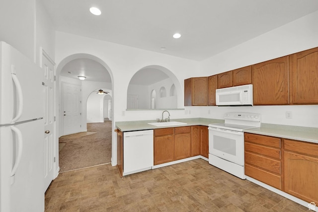 282 Caleb Dr, North Salt Lake, UT 84054 - kitchen featuring white appliances, a sink, light countertops, brown cabinetry, and recessed lighting