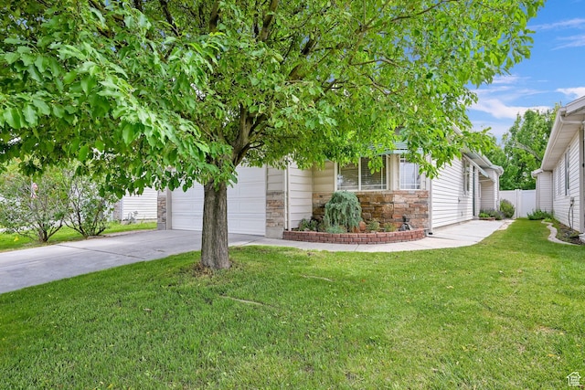 282 Caleb Dr, North Salt Lake, UT 84054 - view of property hidden behind natural elements featuring stone siding, concrete driveway, and an attached garage