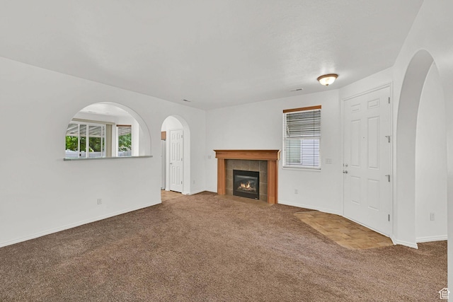 282 Caleb Dr, North Salt Lake, UT 84054 - unfurnished living room with carpet, plenty of natural light, and arched walkways