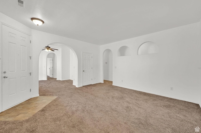 282 Caleb Dr, North Salt Lake, UT 84054 - carpeted spare room with arched walkways and baseboards