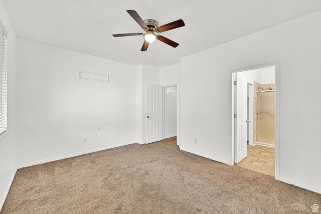 282 Caleb Dr, North Salt Lake, UT 84054 - unfurnished bedroom with carpet, baseboards, connected bathroom, and ceiling fan
