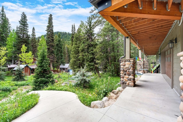 11316 E Silver Fork Rd, Brighton, UT 84121 - porch featuring a view of trees