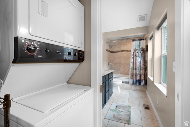 11316 E Silver Fork Rd, Brighton, UT 84121 - washroom with estacked washer and dryer and light tile patterned floors