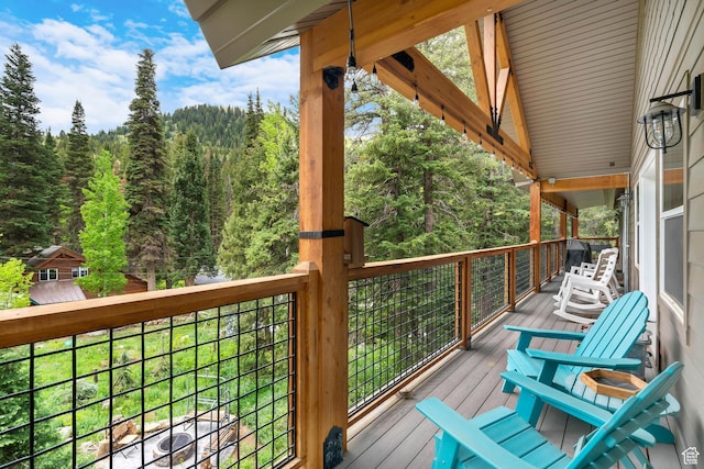 11316 E Silver Fork Rd, Brighton, UT 84121 - wooden terrace with a forest view
