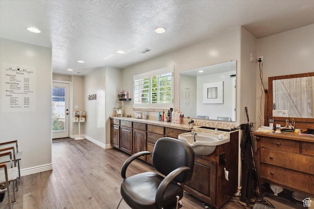 969 S View Crest Ln W, Kaysville, UT 84037 - office area with wood finished floors, a sink, recessed lighting, baseboards, and a textured ceiling