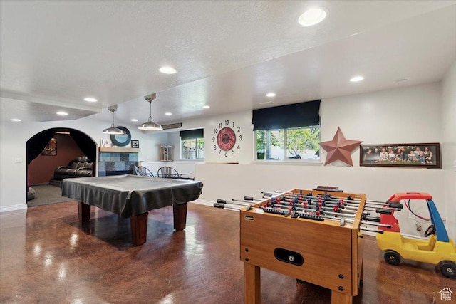 969 S View Crest Ln W, Kaysville, UT 84037 - playroom featuring recessed lighting, billiards, baseboards, finished concrete flooring, and arched walkways