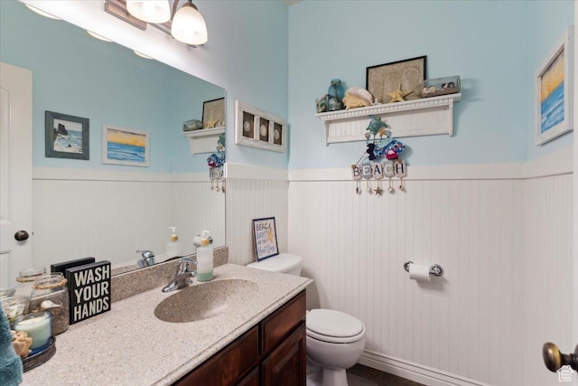 969 S View Crest Ln W, Kaysville, UT 84037 - bathroom featuring toilet, a wainscoted wall, and vanity